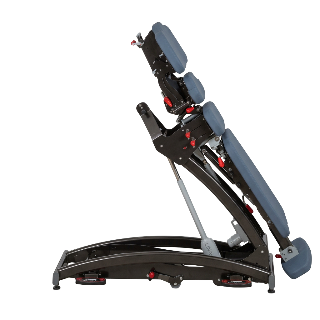 Electric operating table shown in steep tilt position